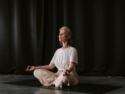 Close up of hands in a mudra position.